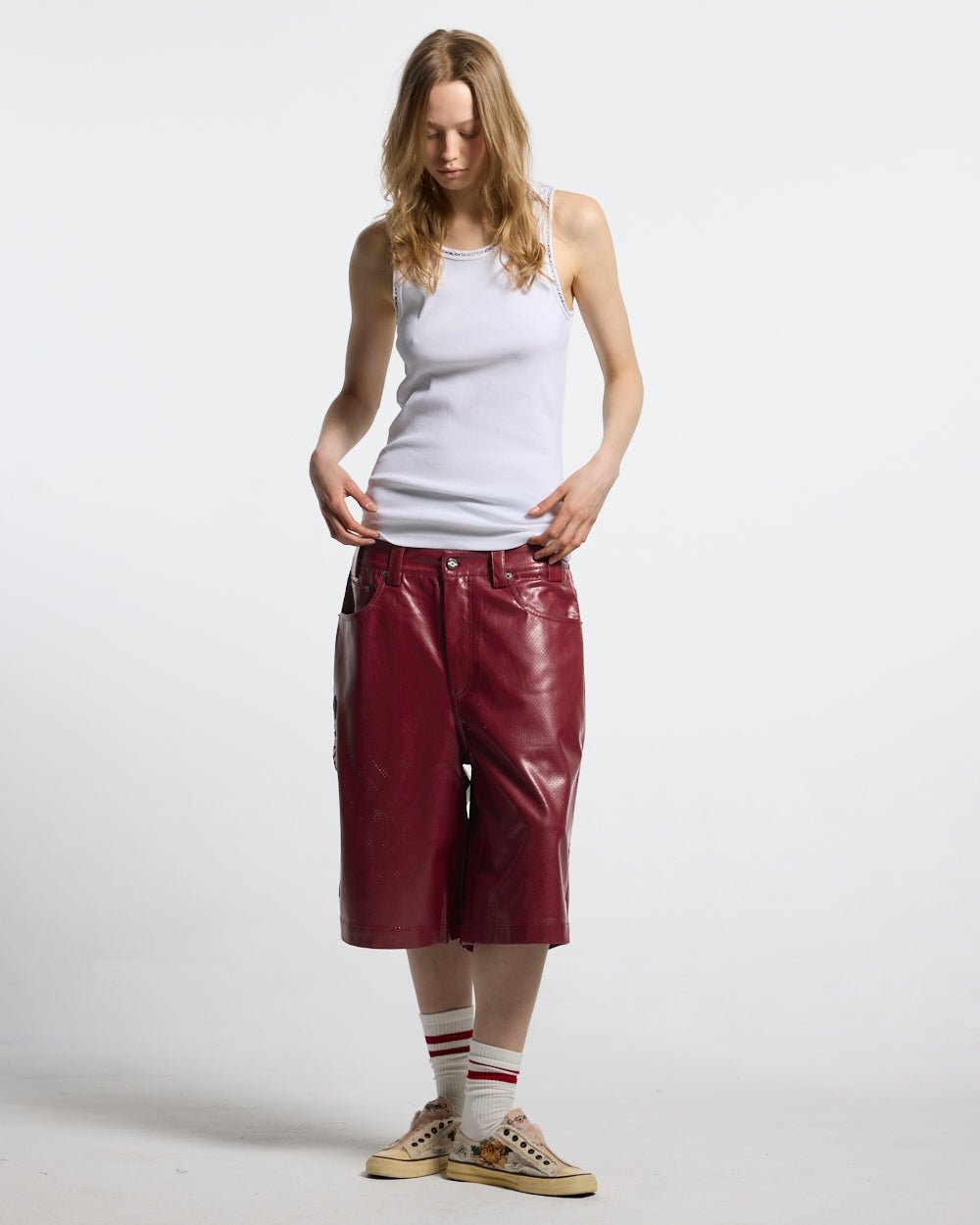 BRAVE SHORT BURGUNDY - burgundy perforated leather shorts, front view on female model - Cold Culture #woman