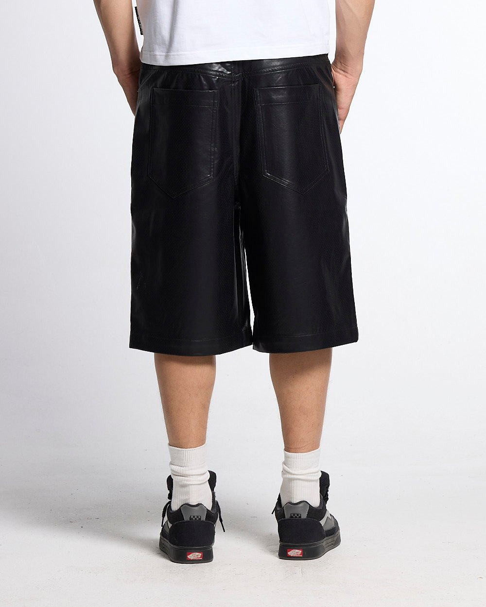 BRAVE SHORTS BLACK - black faux leather shorts, back view on male model - Cold Culture