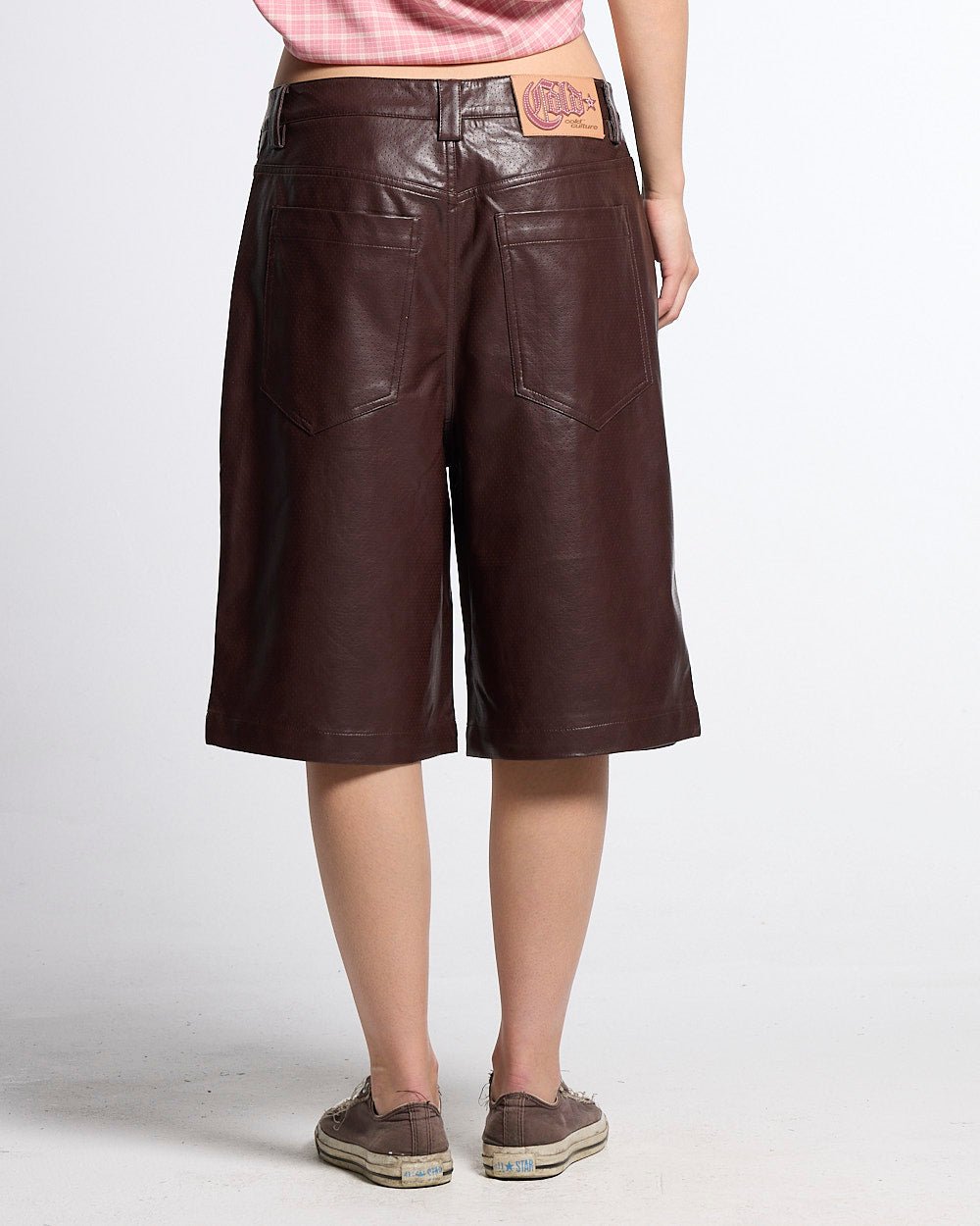 BRAVE SHORTS BROWN - brown faux leather shorts, back view on female model - Cold Culture #woman