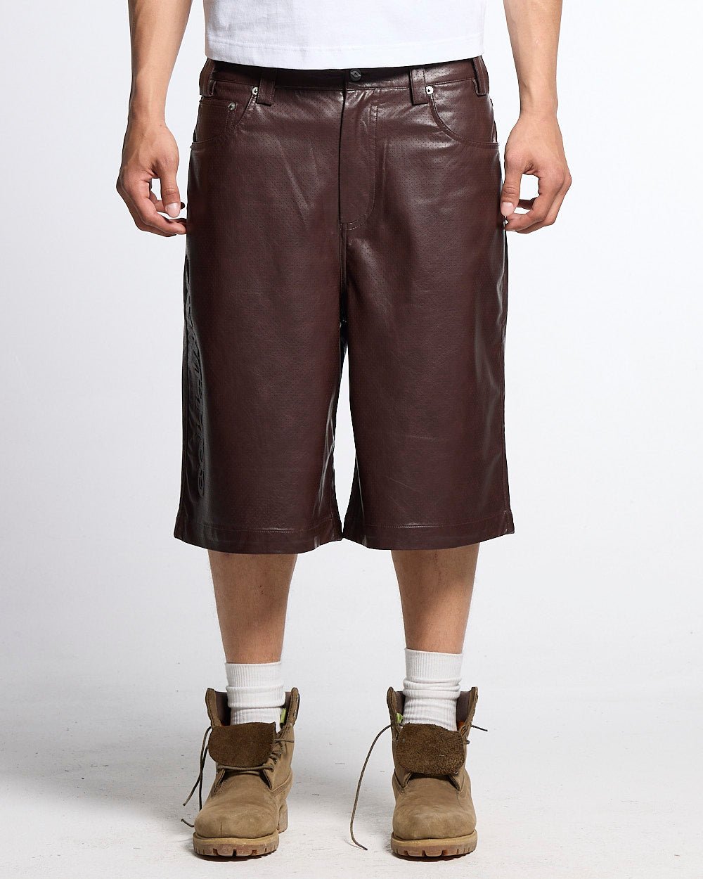 BRAVE SHORTS BROWN - brown faux leather shorts, front view on male model - Cold Culture