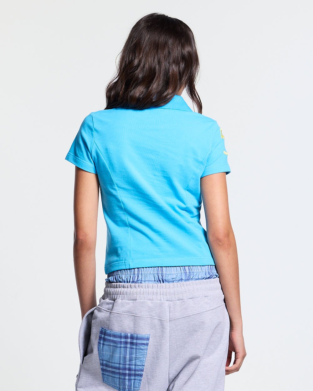 BRIDLE POLO BLUE - blue embroidered polo shirt, back view on female model - Cold Culture #woman