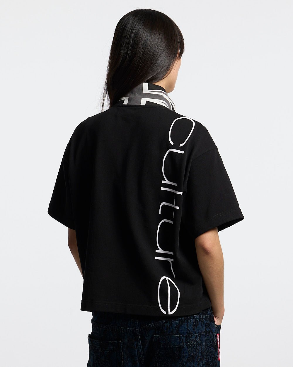 BRIGHTON POLO BLACK - black cropped polo shirt, back view on female model - Cold Culture #woman