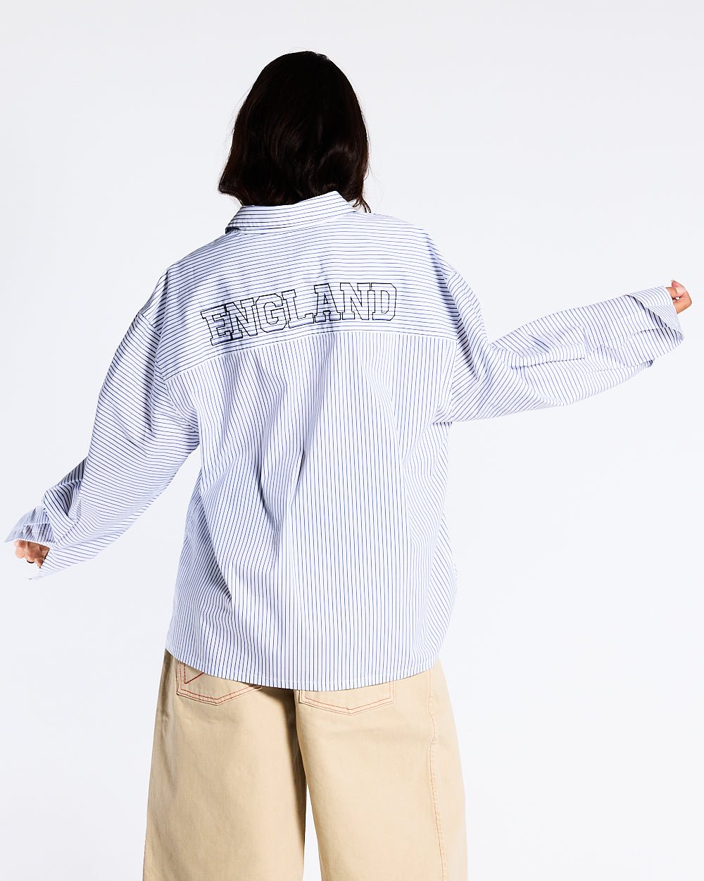 BRIGHTON SHIRT NAVY AND WHITE - blue and white striped shirt, back view on female model - Cold Culture #woman