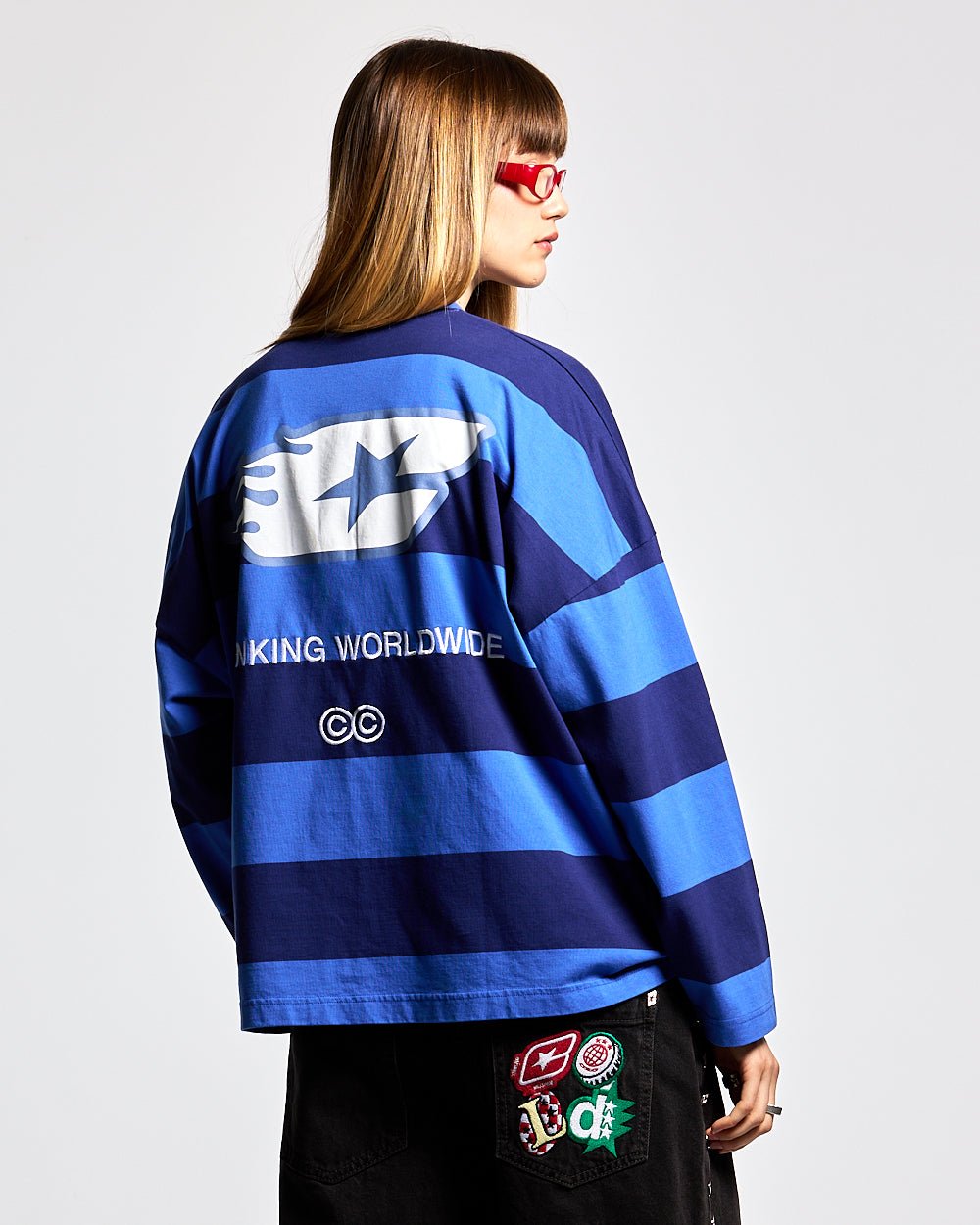 BURNIN STRIPES LONGSLEEVE BLACK AND BLUE - blue striped longsleeve tee, back view on female model - Cold Culture #woman