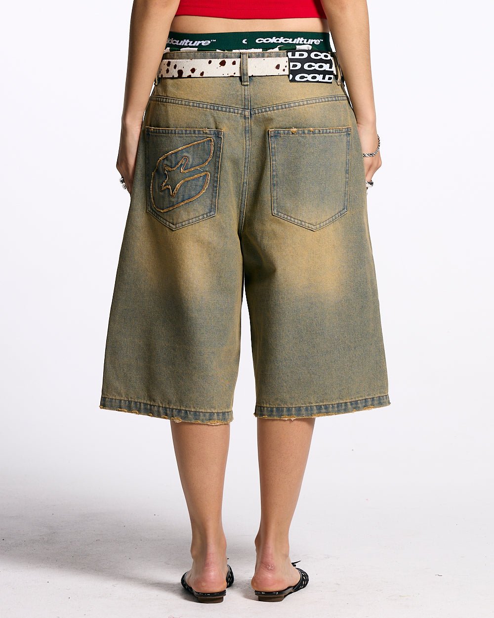 C V2 DIRTY DENIM SHORTS - washed denim shorts, back view on female model - Cold Culture #woman
