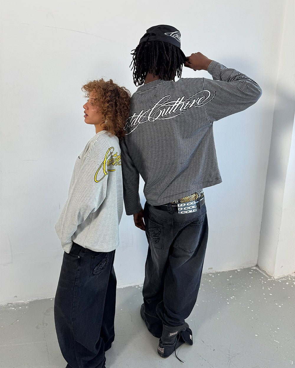 C V2 DIRTY PANTS BLACK - washed black baggy pants, back view on male model - Cold Culture #woman