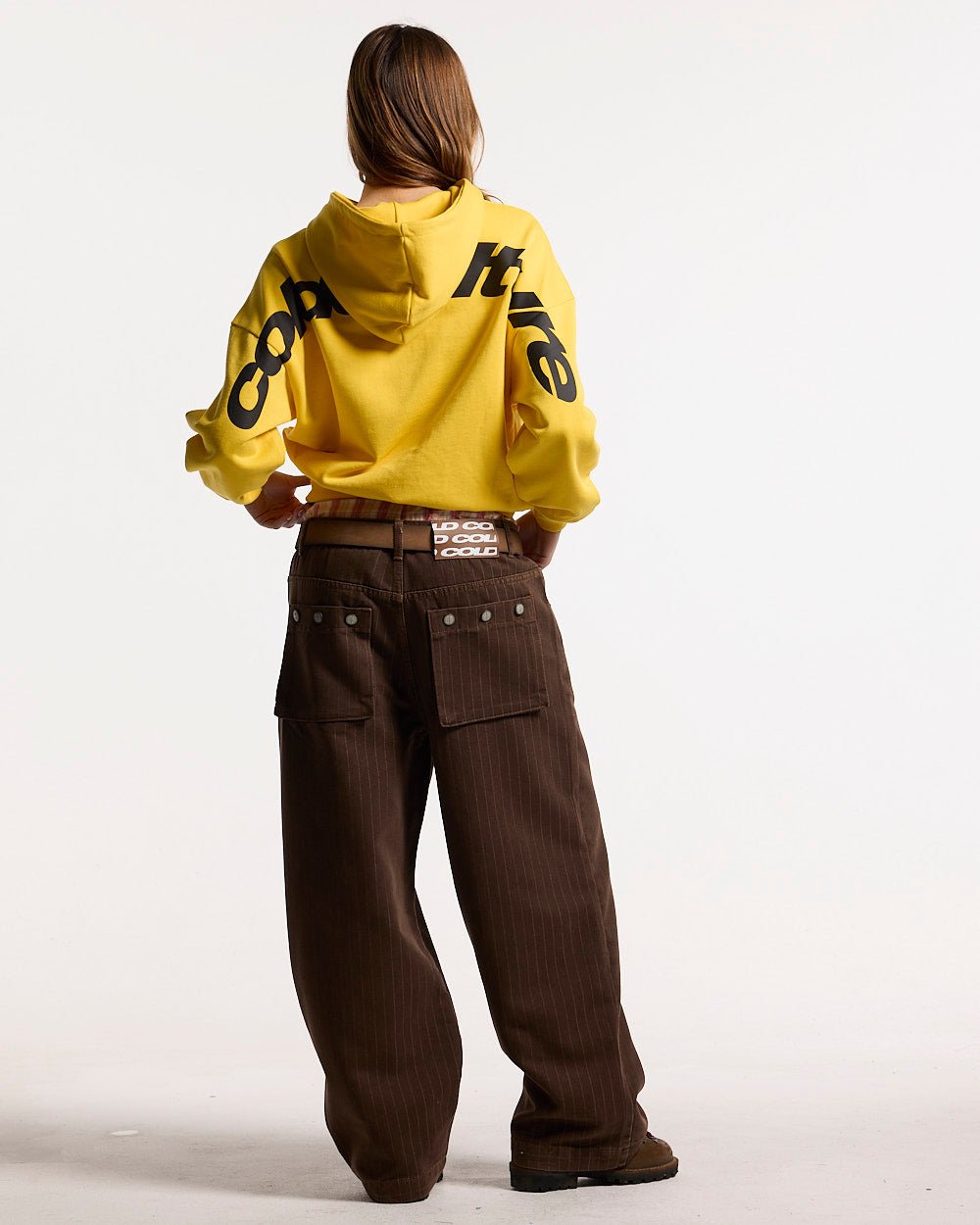 CASINO PANTS BROWN DENIM - brown pinstripe denim pants, back view on female model - Cold Culture #woman