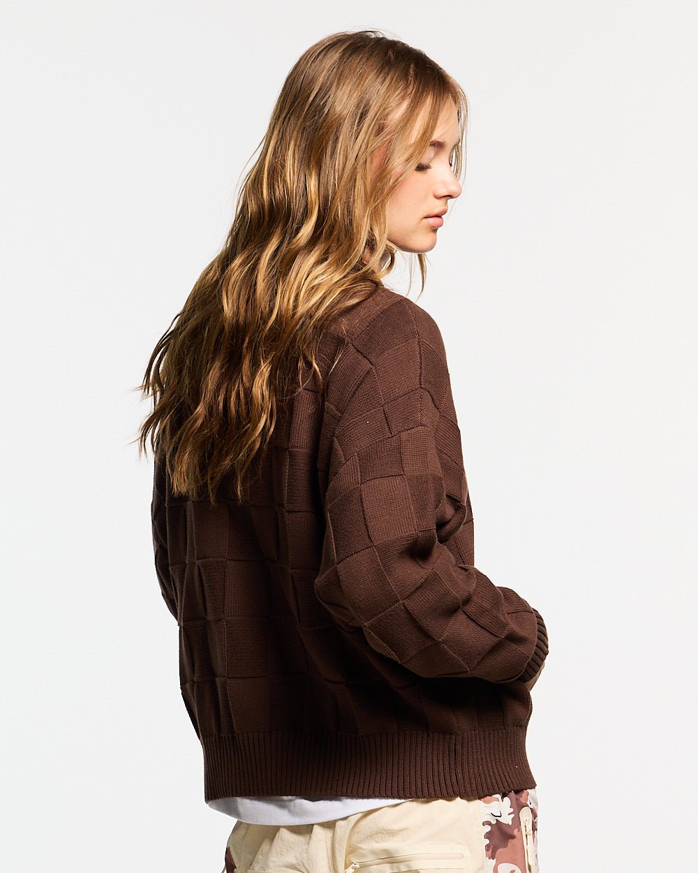 CHECKMATE KNITWEAR BROWN - brown checkerboard knit sweater, back view on female model - Cold Culture #woman