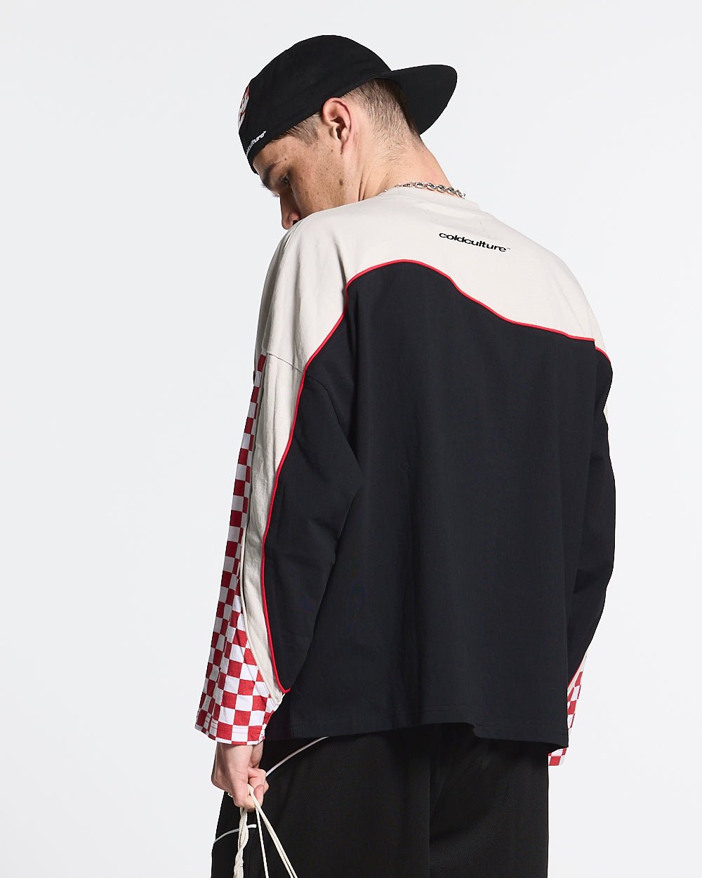 CHESS FLAMES TEE - black and cream checkered longsleeve tee, back view on male model - Cold Culture #man