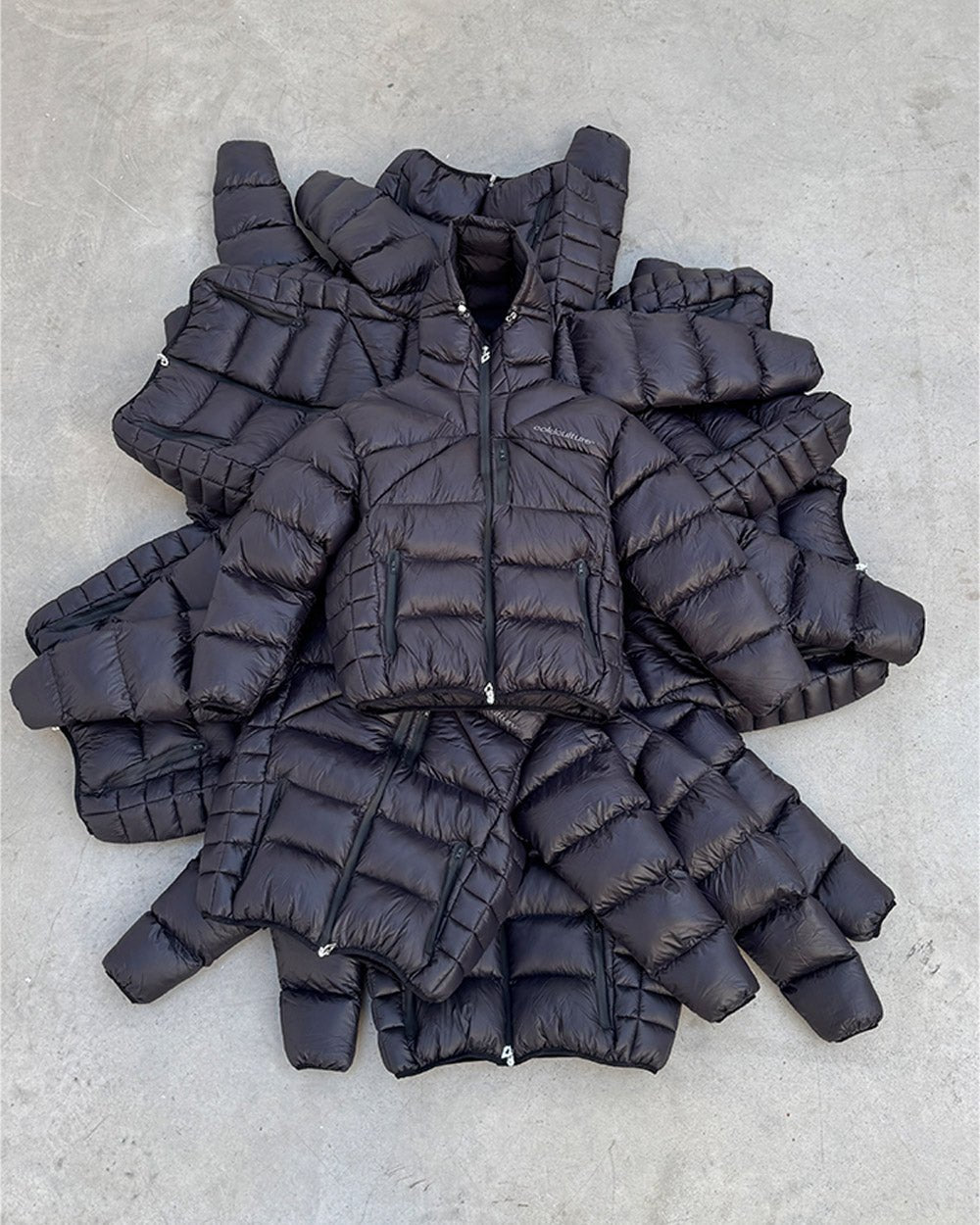 CLOUD ARMOR PUFFER BLACK - black glossy puffer jacket, flat lay with matching pieces - Cold Culture