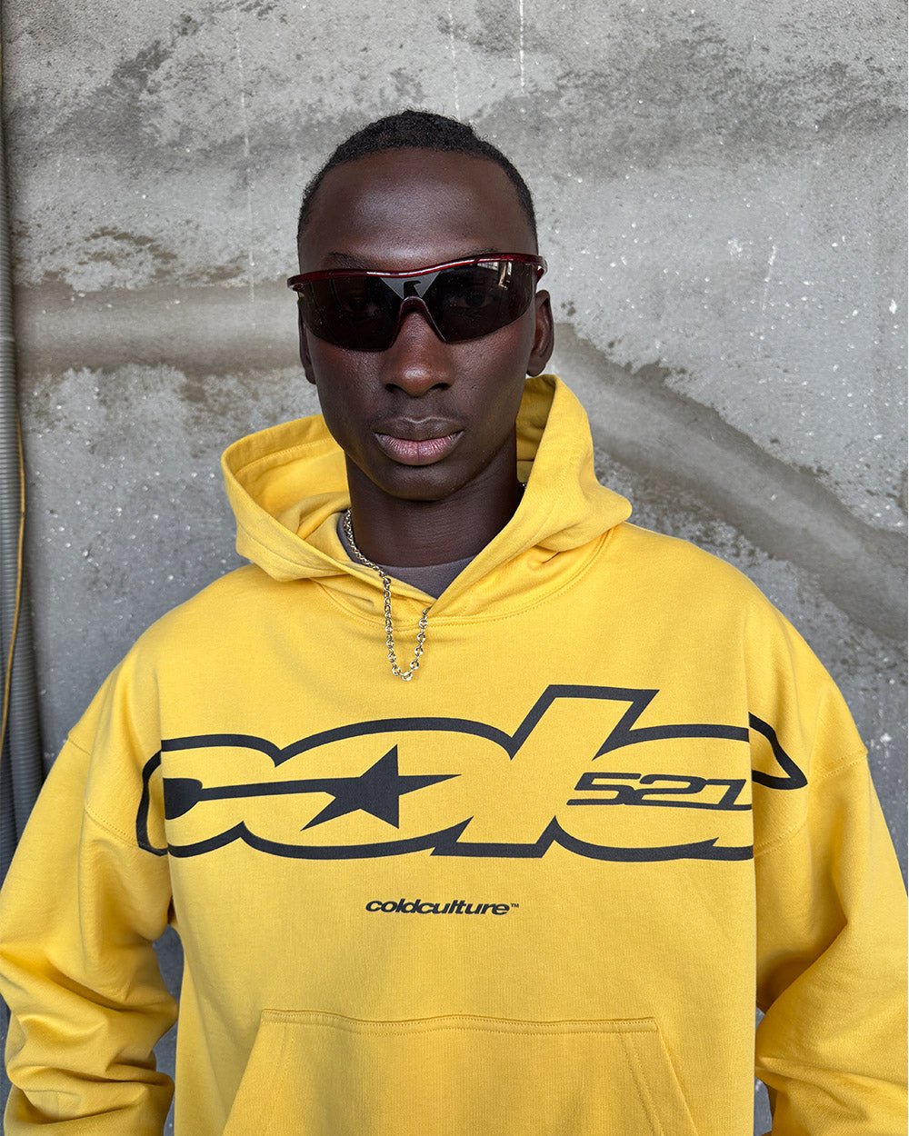 COLD 521 HOODIE YELLOW - yellow logo print hoodie, on model close-up - Cold Culture