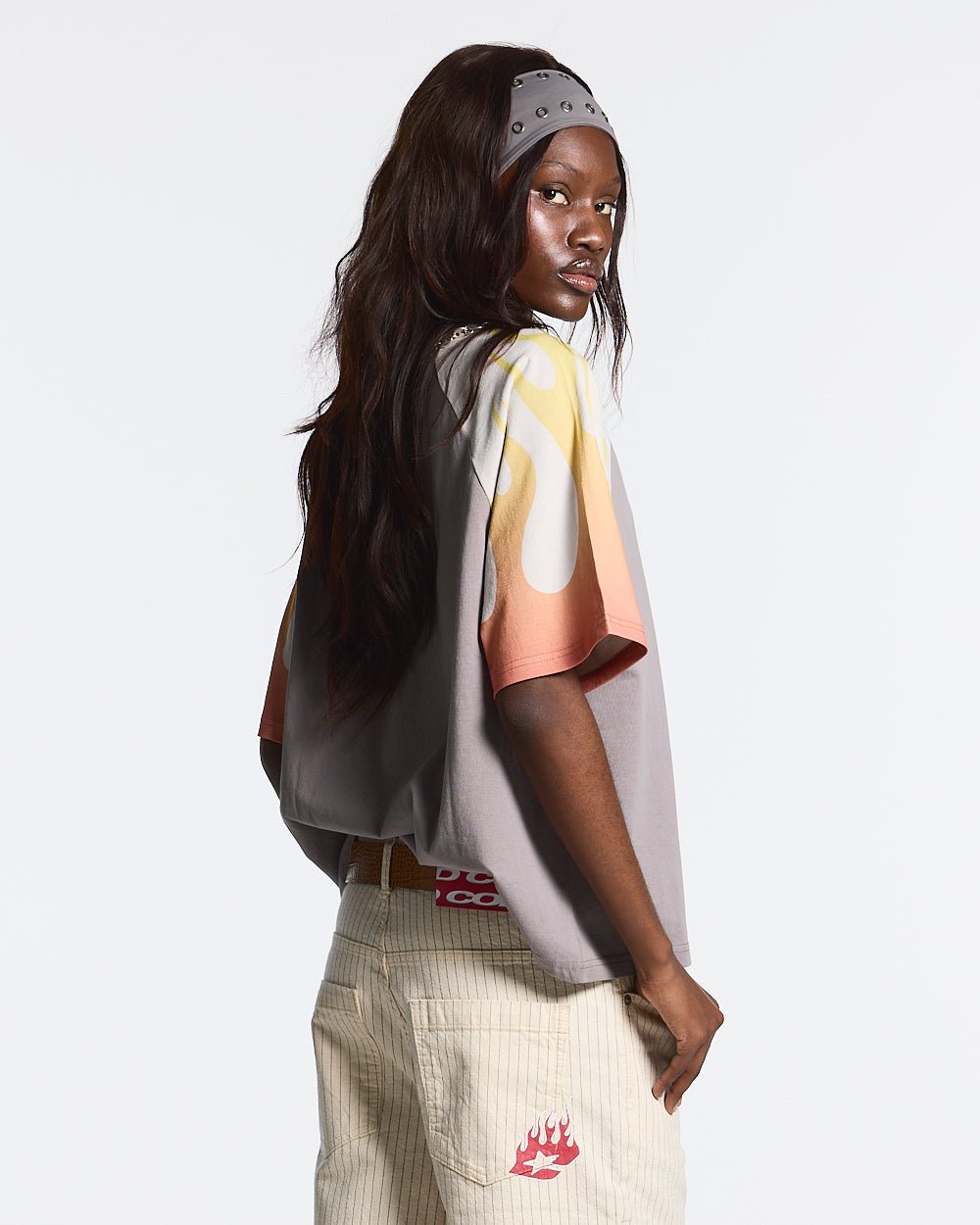 COLD FLAMES TEE ORANGE - grey and orange flame print tee, back view on female model - Cold Culture #woman