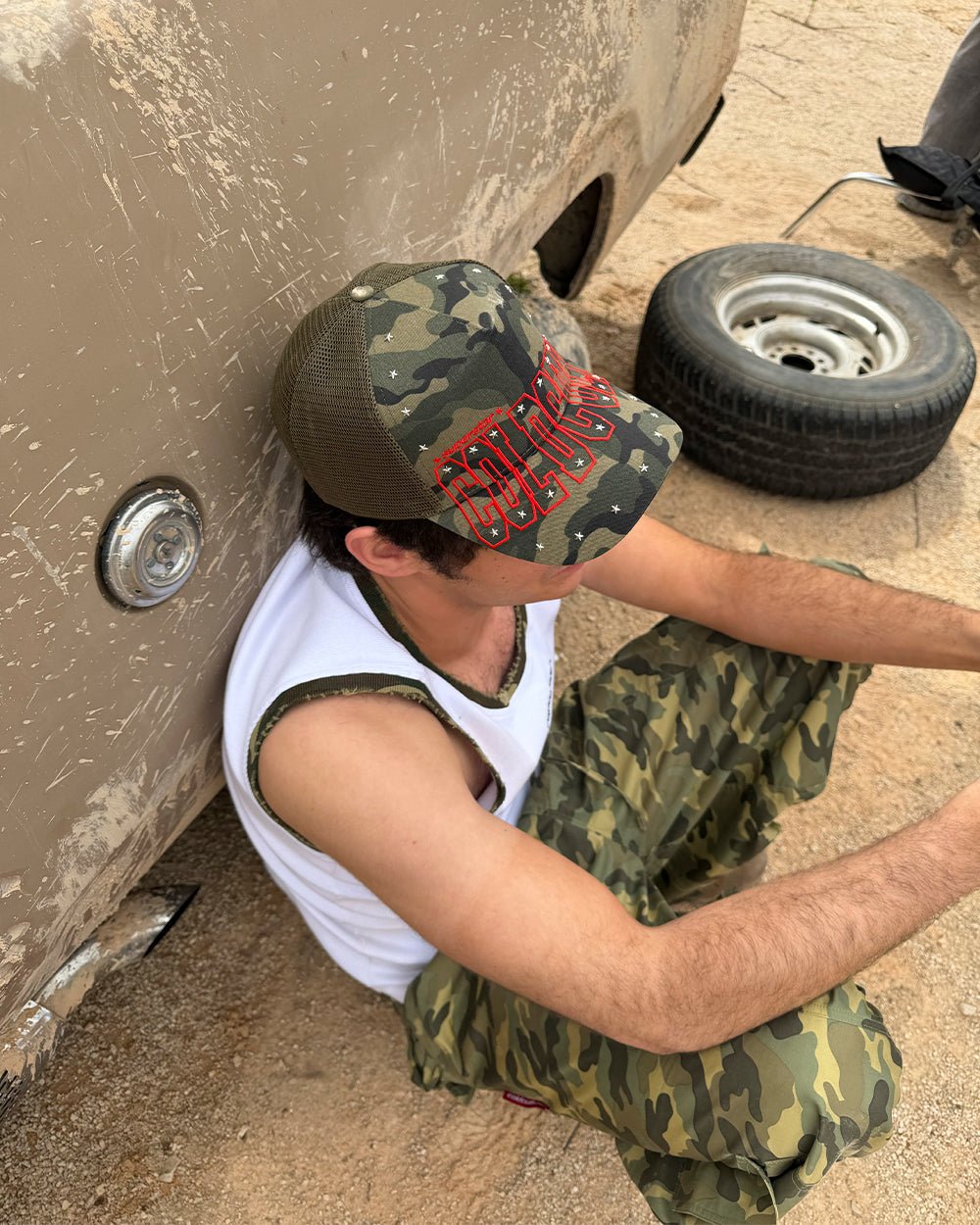 COLDCULT CAP GREEN - green camo trucker cap, street style shot - Cold Culture