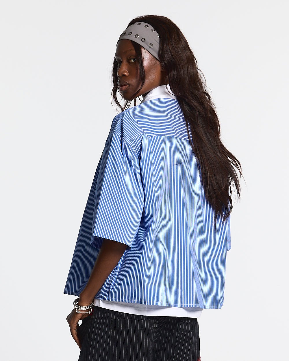 COLDCULT STRIPED SHIRT - blue striped short sleeve shirt, back view on female model - Cold Culture #woman