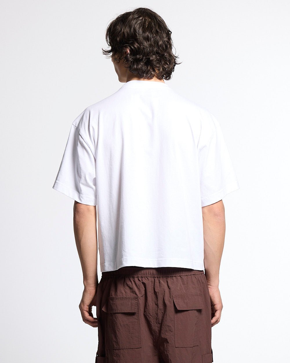 COLLECTIVE TEE WHITE - white graphic print tee, back view on male model - Cold Culture #man