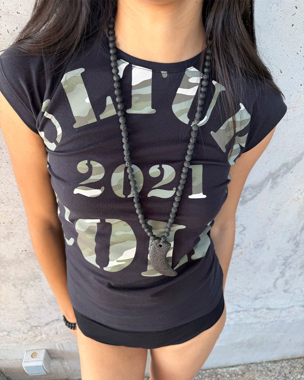 COMMAND BABY TEE BLACK - black camo print baby tee, on model close-up - Cold Culture