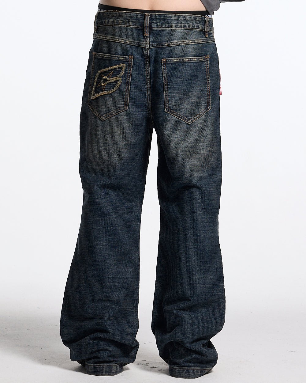 CONCRETE BOOTCUT JEANS BLUE - washed blue bootcut jeans, back view on male model - Cold Culture