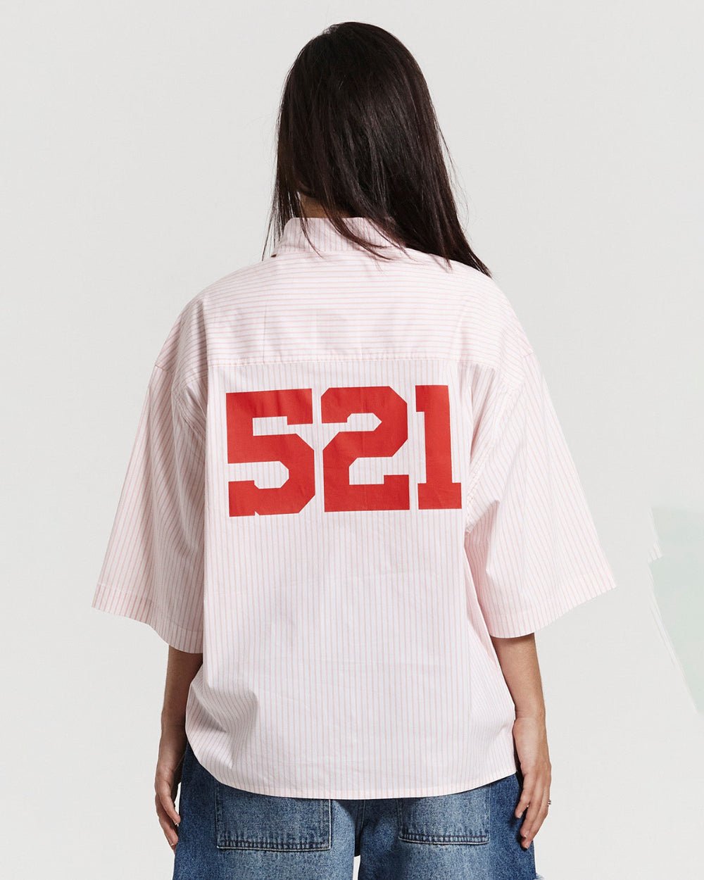 COUNTDOWN SHIRT PINK STRIPES - pink striped short sleeve shirt, back view on female model - Cold Culture #woman
