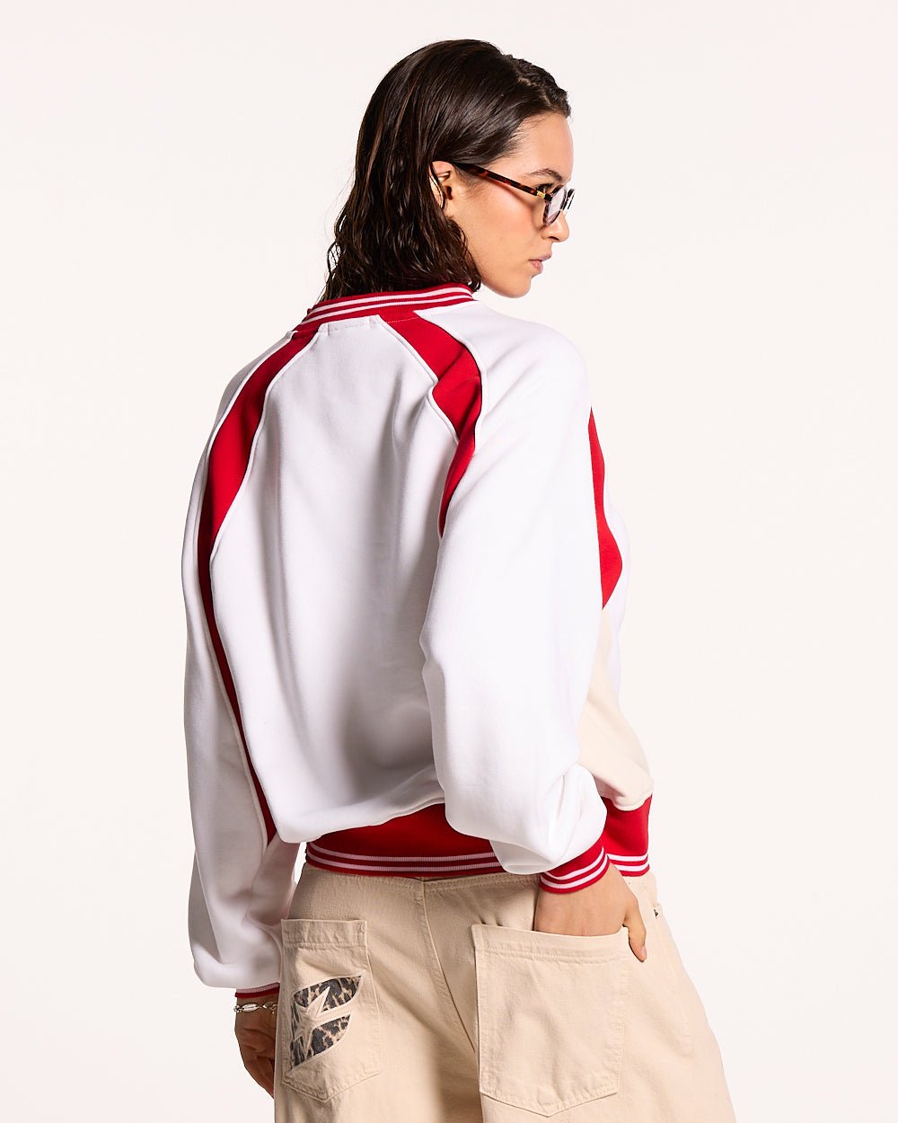 COWBOY VARSITY CREWNECK FIERY RED - red and white varsity crewneck, back view on female model - Cold Culture #woman