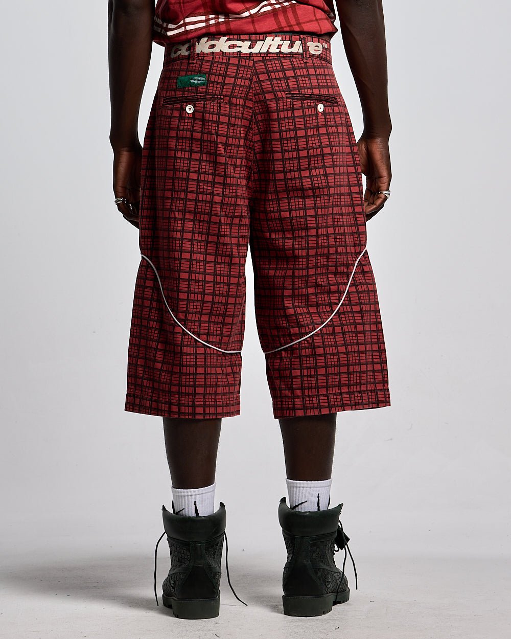 CRIMSON PLAID SUIT JORTS - red plaid shorts, back view on male model - Cold Culture