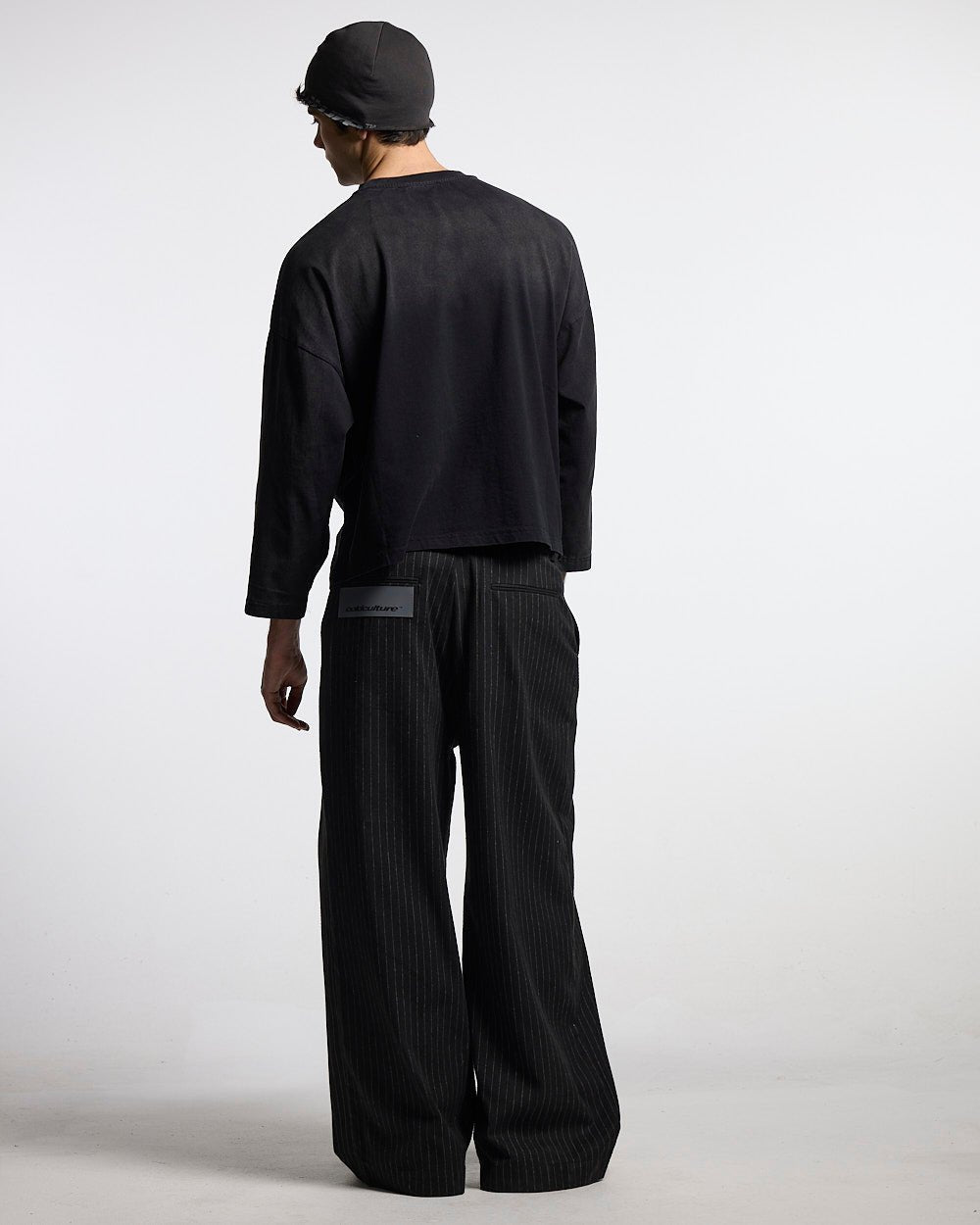 CROSSED SCRIPT LONGSLEEVE 2.0 BLACK - black script print longsleeve tee, back view on male model - Cold Culture #man