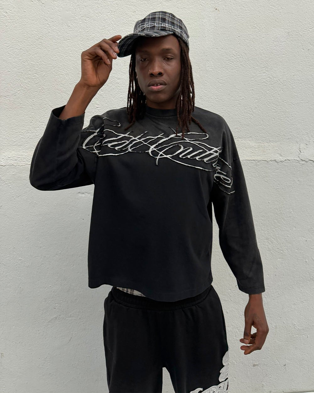 CROSSED SCRIPT LONGSLEEVE 2.0 BLACK - black script print longsleeve tee, street style shot - Cold Culture