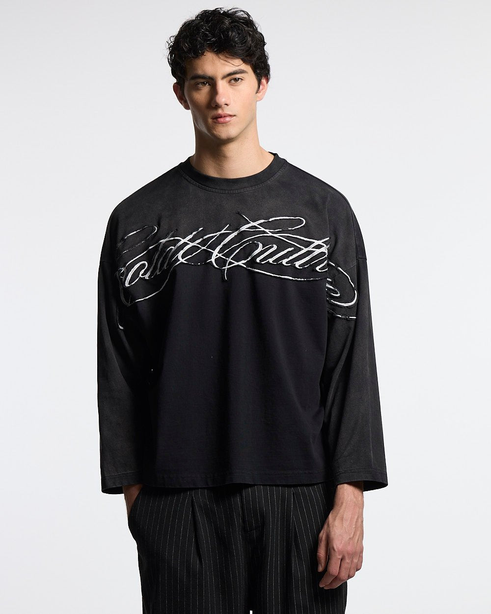 CROSSED SCRIPT LONGSLEEVE 2.0 BLACK - black script print longsleeve tee, front view on male model - Cold Culture #man