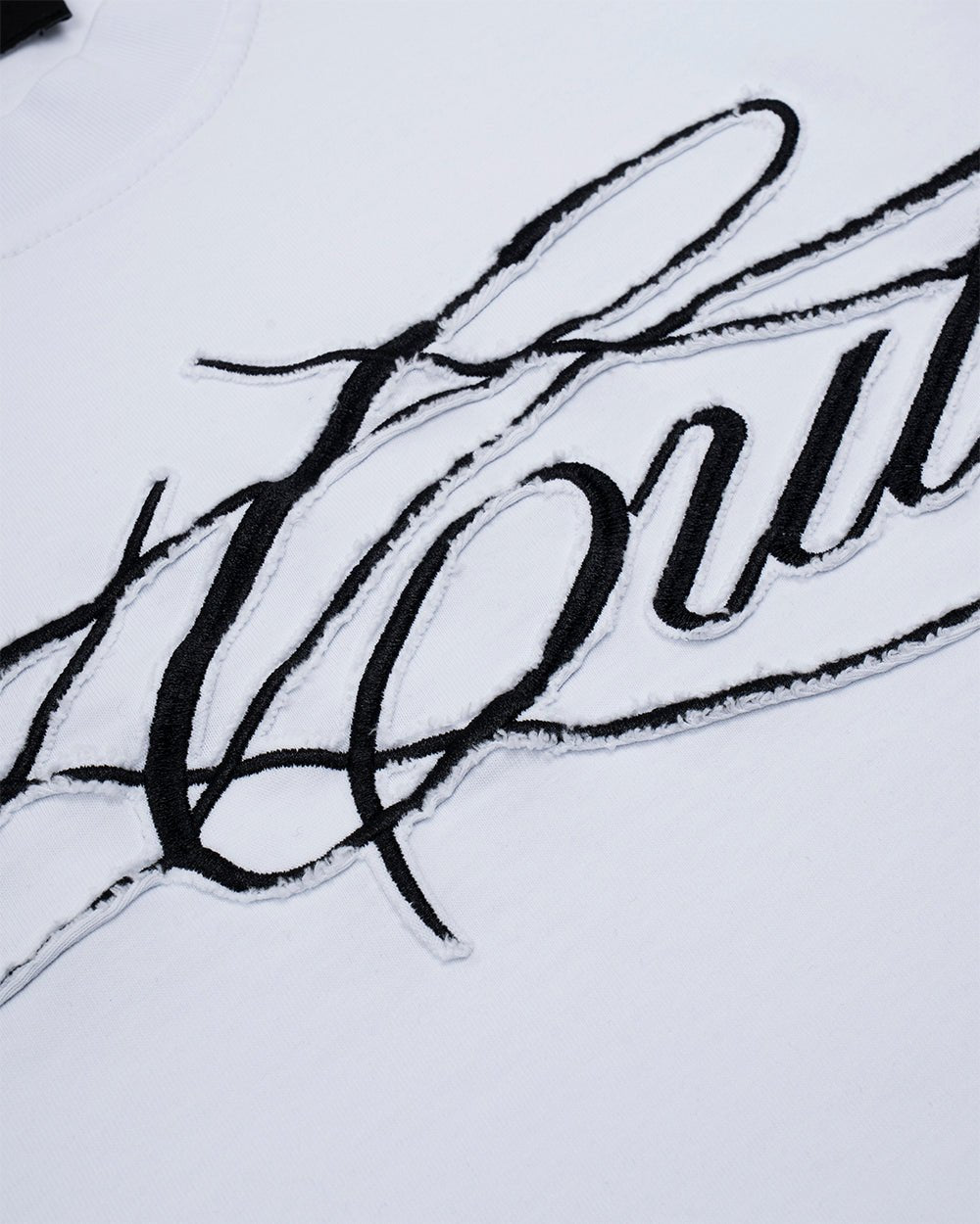 CROSSED SCRIPT LONGSLEEVE 2.0 WHITE - white script print longsleeve tee, detail close-up - Cold Culture
