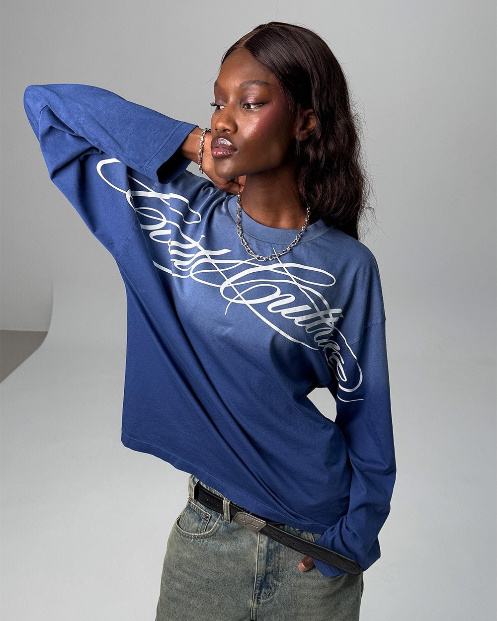 CROSSED SCRIPT LONGSLEEVE VIBRANT BLUE - washed blue script print longsleeve tee, front view on female model - Cold Culture #woman