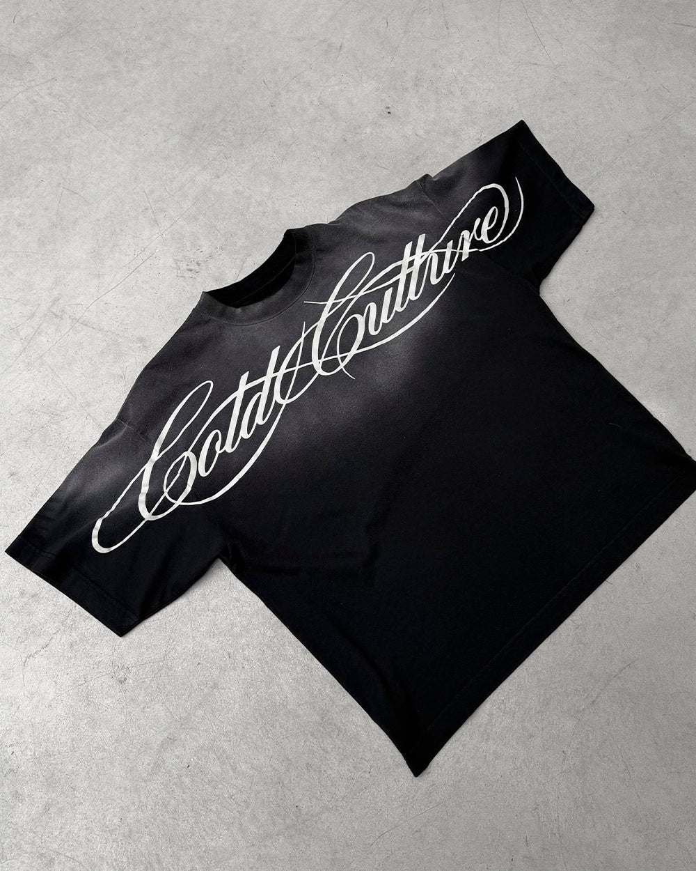 CROSSED SCRIPT TEE BLACK - washed black tee, flat lay - Cold Culture