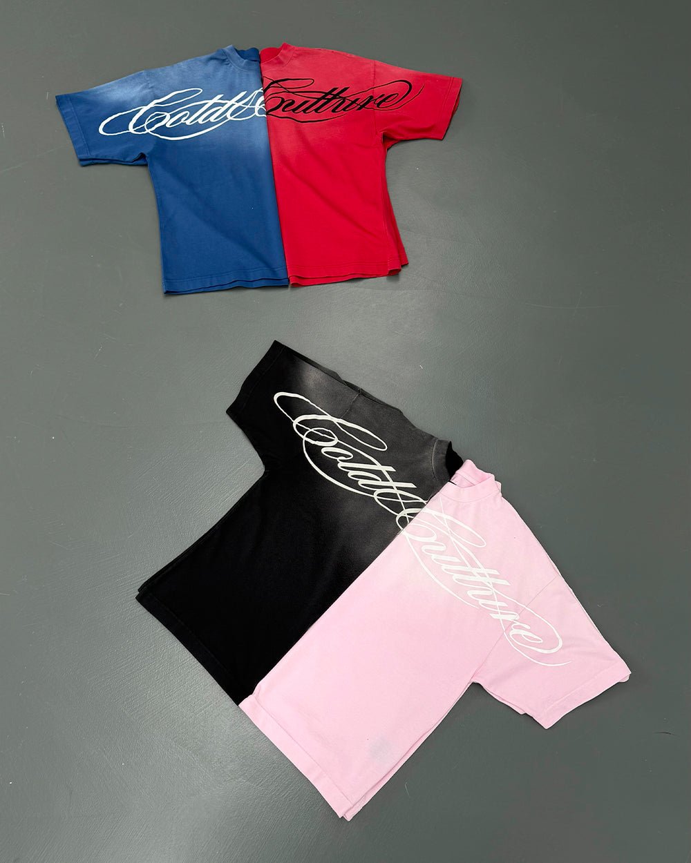 CROSSED SCRIPT TEE PINK - washed pink tee, flat lay with matching pieces - Cold Culture
