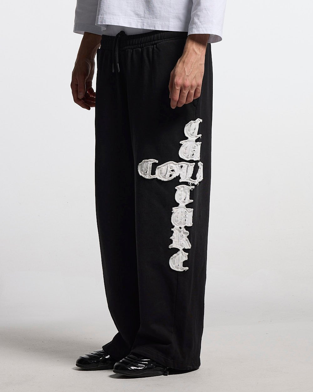 CROSSED SWEATPANTS BLACK - black baggy sweatpants, side view - Cold Culture