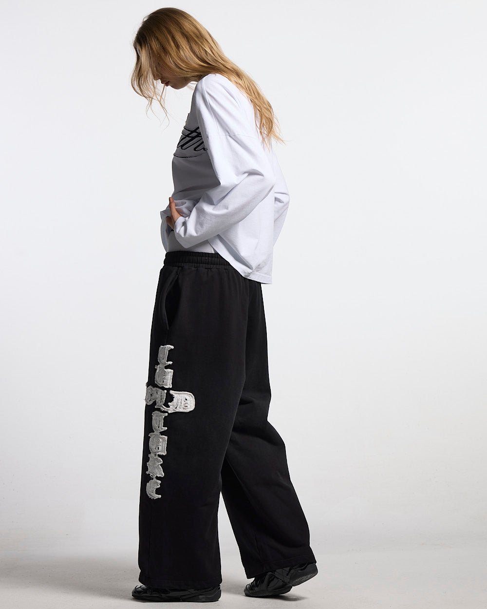 CROSSED SWEATPANTS BLACK - black baggy sweatpants, side view - Cold Culture #woman