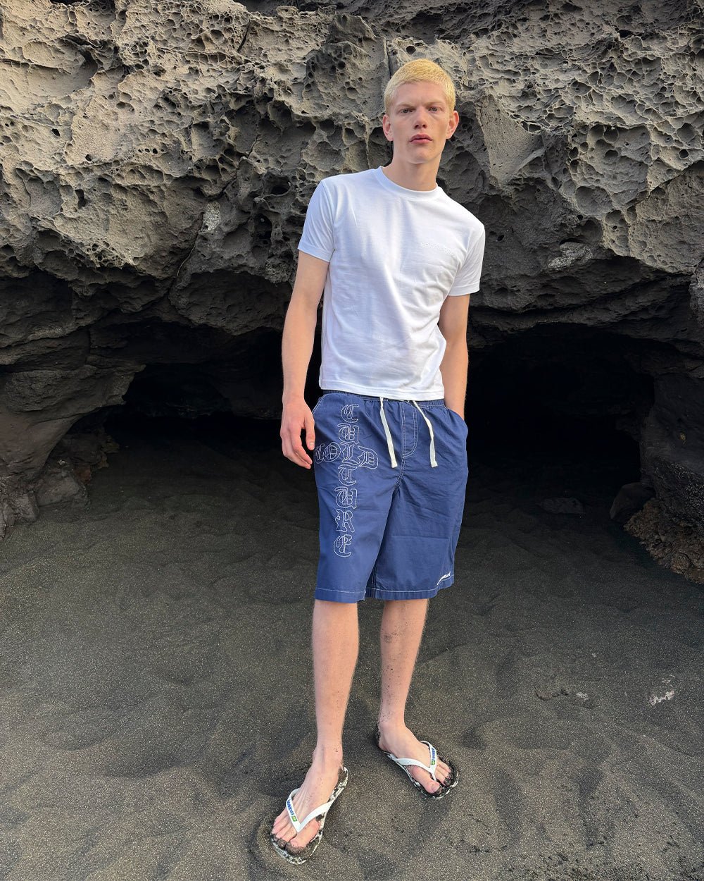 CROSSED SWIMSHORTS BLUE - navy gothic print swim shorts, street style shot - Cold Culture