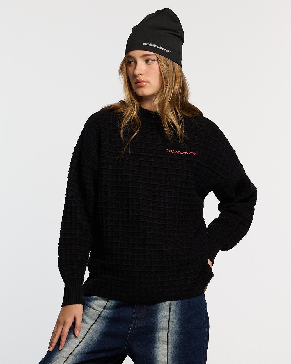 CRUNCHY WAFFLE KNIT BLACK - black waffle knit sweater, front view on female model - Cold Culture #woman