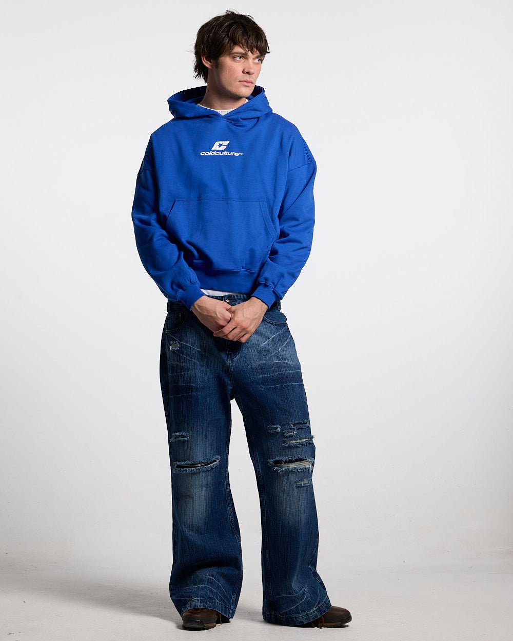 CURVED HOODIE BLUE - royal blue logo print hoodie, front view on male model - Cold Culture #man