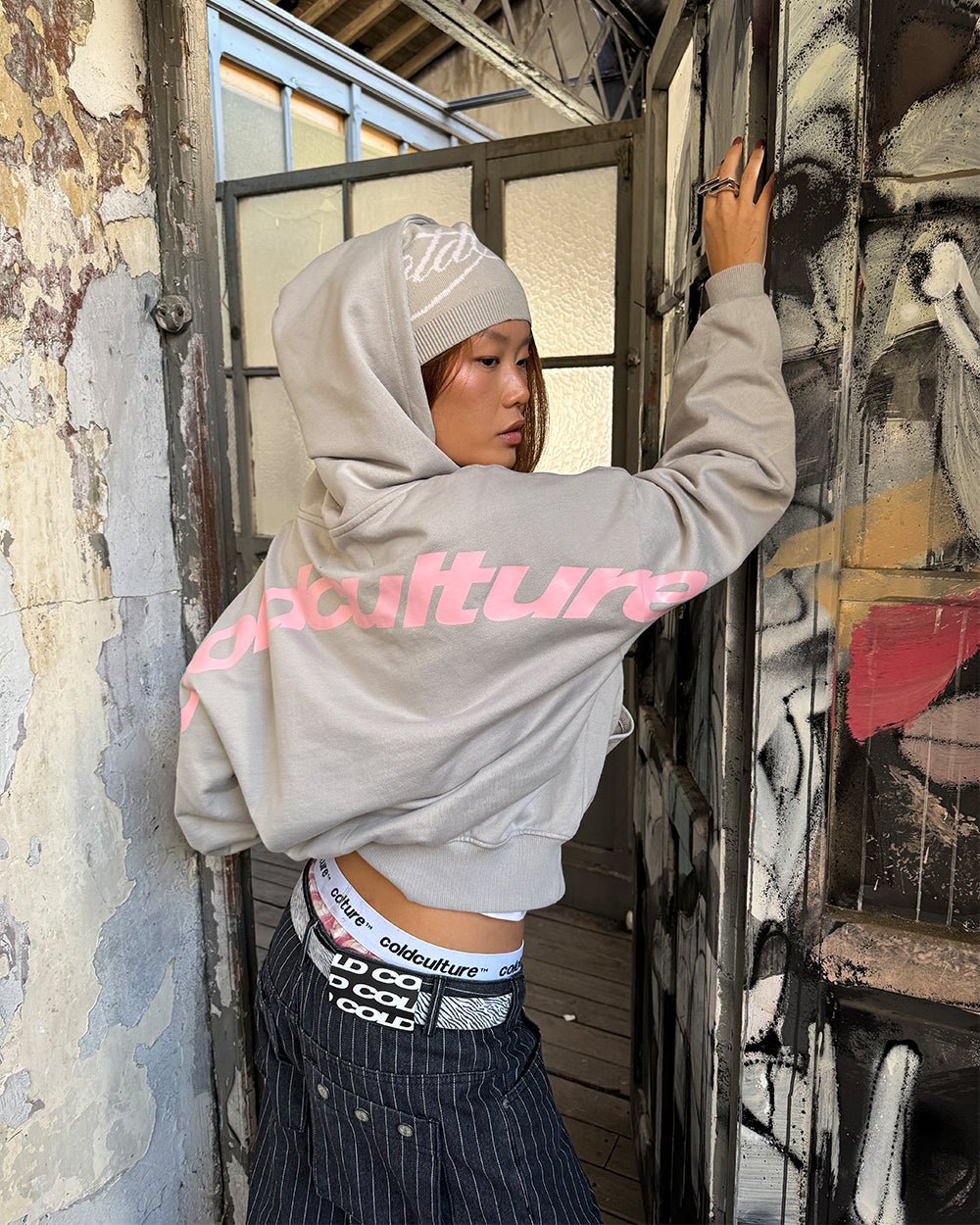 CURVED HOODIE GREY - grey logo print hoodie, street style shot - Cold Culture #woman