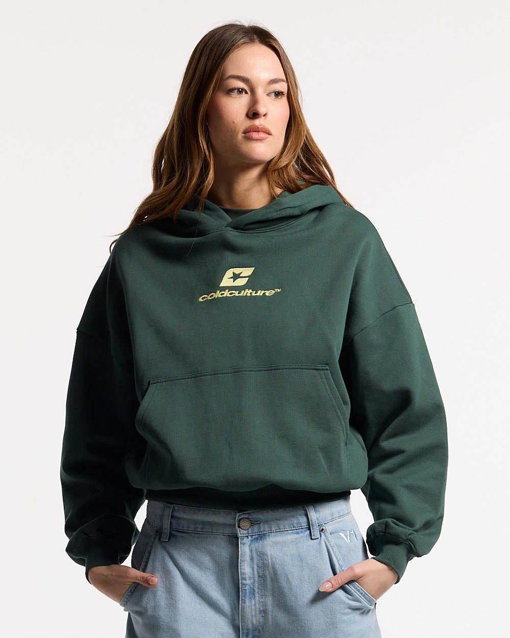 CURVED HOODIE JUNGLE GREEN - green oversized hoodie, front view on female model - Cold Culture #woman