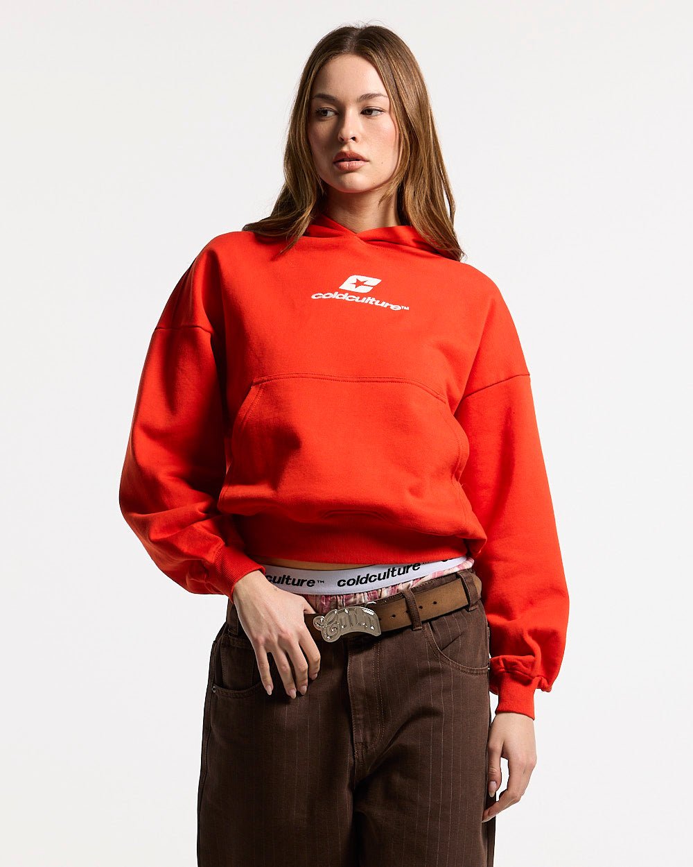 CURVED HOODIE VIBRANT RED - red logo print hoodie, front view on female model - Cold Culture #woman