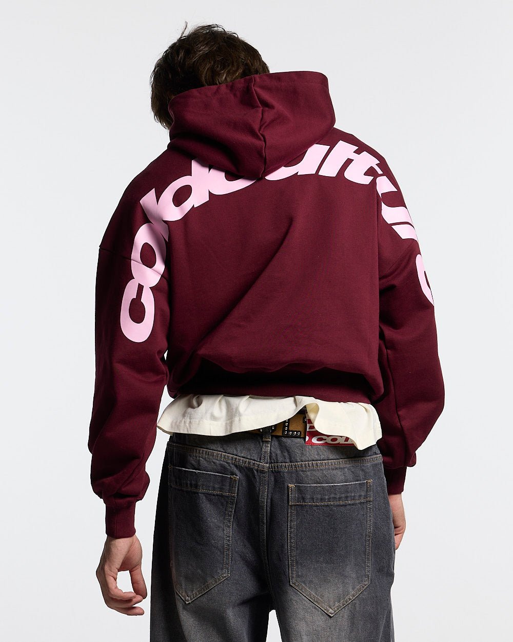 CURVED HOODIE WINE RED - wine red oversized hoodie, back view on male model - Cold Culture