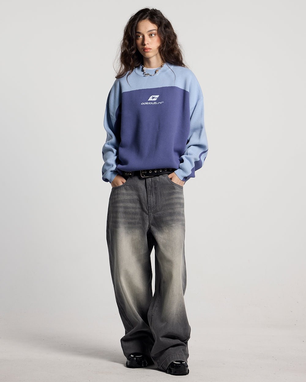 CURVED KNIT BLUE - blue two-tone knit sweater, front view on female model - Cold Culture #woman