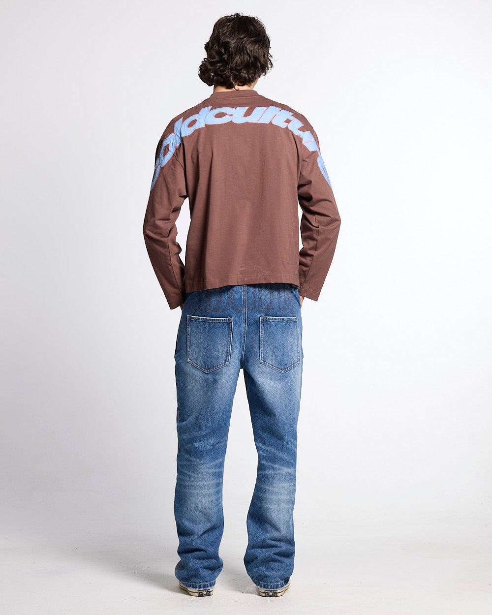 CURVED KNOTS LONGSLEEVE BROWN - brown logo print longsleeve tee, back view on male model - Cold Culture #man