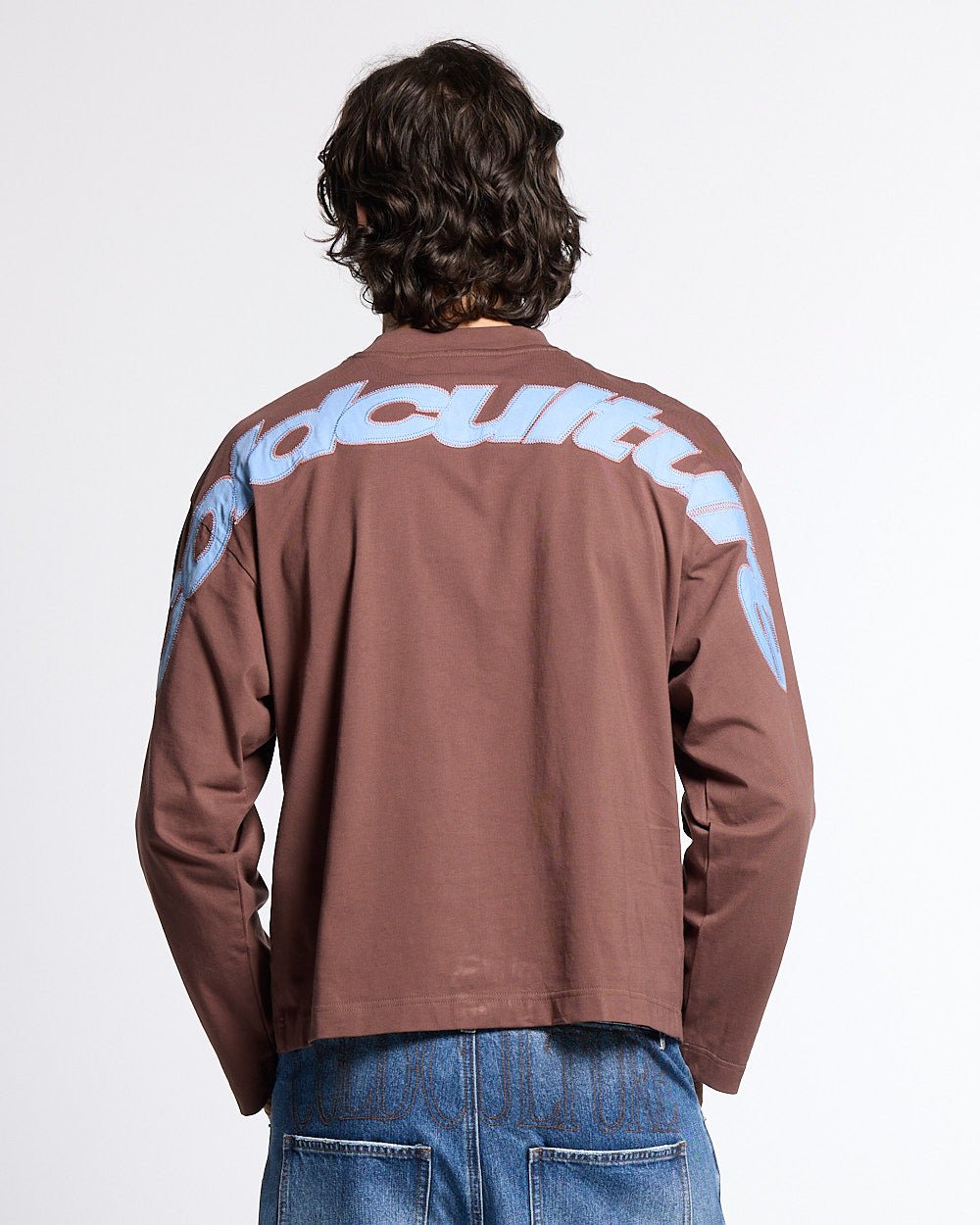 CURVED KNOTS LONGSLEEVE BROWN - brown logo print longsleeve tee, back view on male model - Cold Culture #man