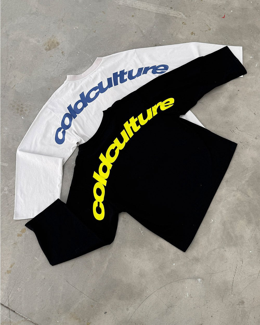 CURVED LONGSLEEVE BLACK - black oversized longsleeve tee, flat lay with matching pieces - Cold Culture