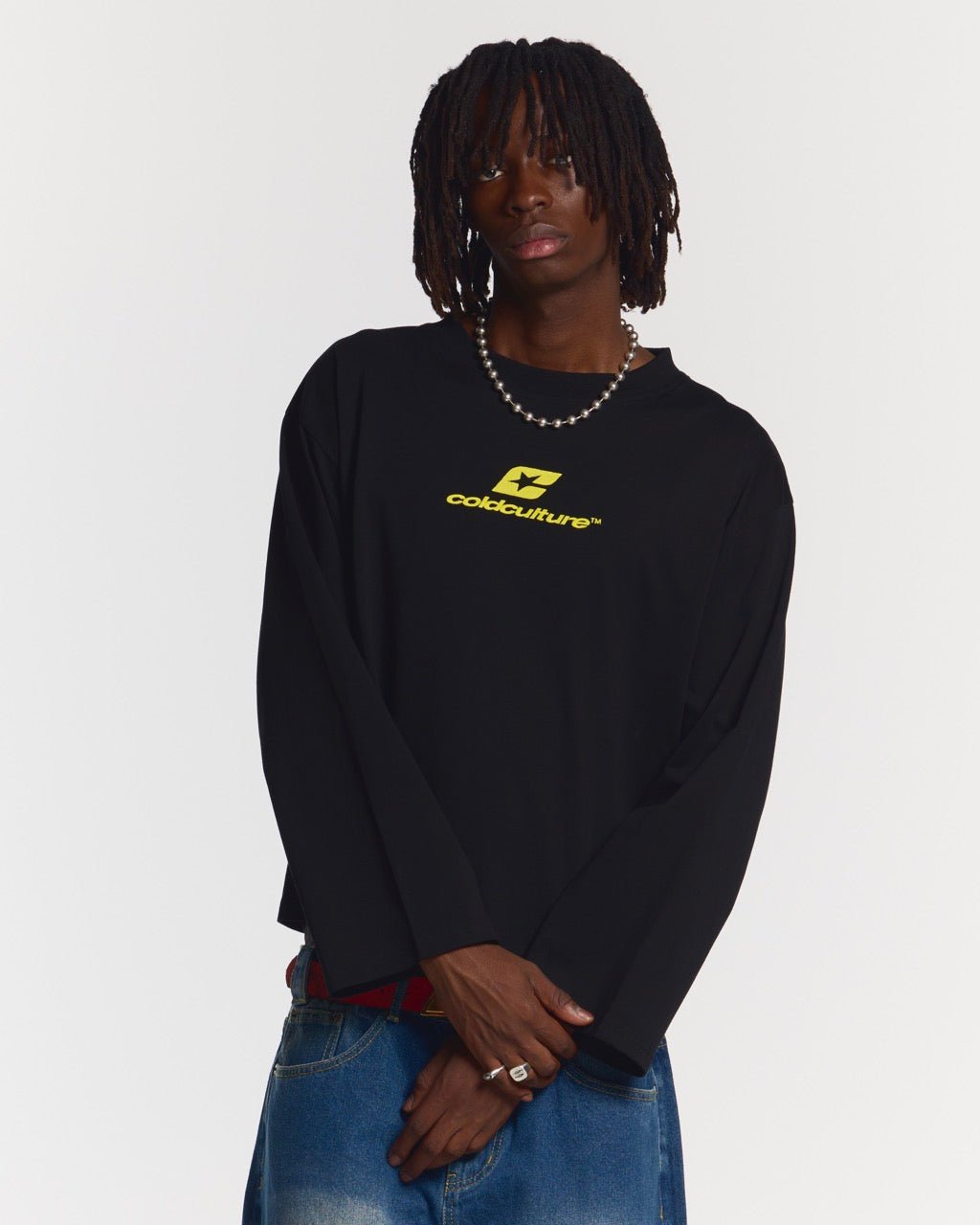 CURVED LONGSLEEVE BLACK - black oversized longsleeve tee, front view on male model - Cold Culture #man