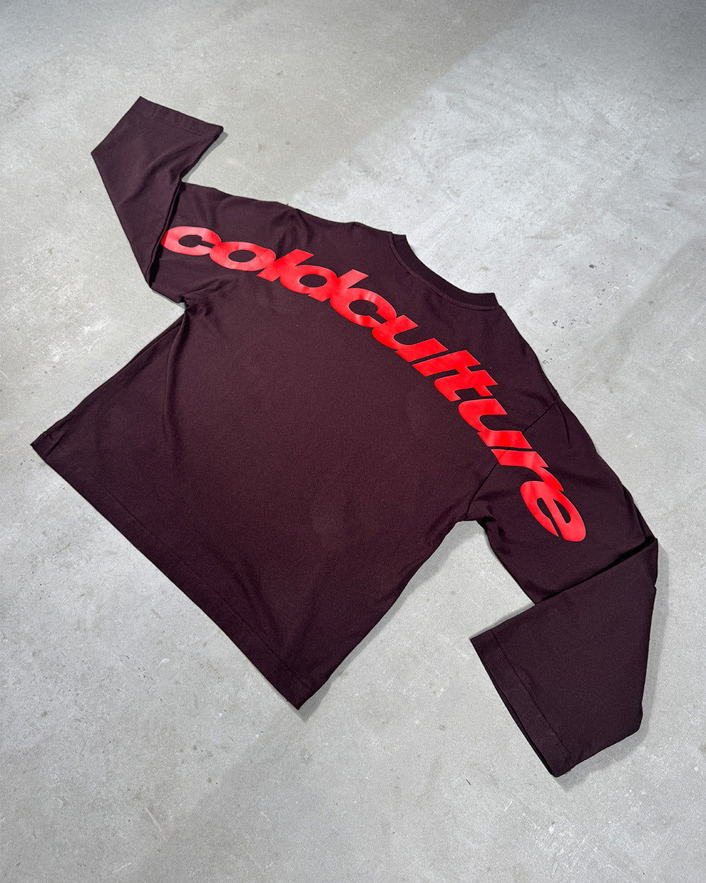 CURVED LONGSLEEVE BROWN - brown oversized longsleeve tee, flat lay - Cold Culture
