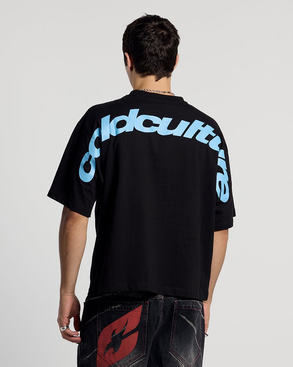 CURVED TEE BLACK & BLUE - black oversized tee, back view on male model - Cold Culture #man