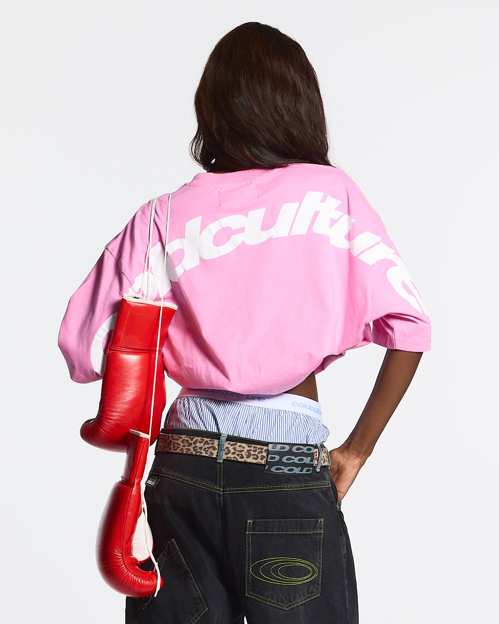 CURVED TEE FUCHSIA PINK - pink oversized tee, back view on female model - Cold Culture #woman