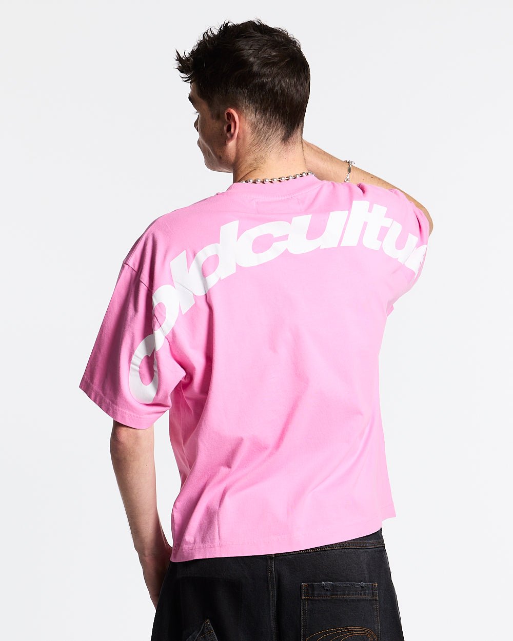 CURVED TEE FUCHSIA PINK - pink oversized tee, back view on male model - Cold Culture #man
