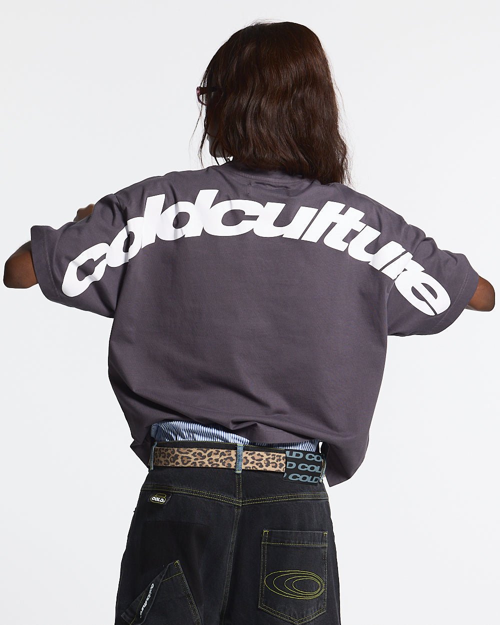 CURVED TEE NINE IRON - dark grey oversized tee, back view on female model - Cold Culture #woman